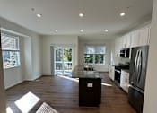 Thumbnail 6 of 18 - A modern interior with wooden walls and a skylight.
