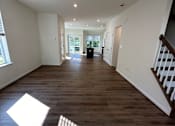 Thumbnail 10 of 18 - A room with wooden walls and a window with blinds.