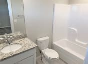 Thumbnail 24 of 60 - B2 (2-car) Guest Bath with granite countertops, sink, toilet, and shower