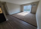 Thumbnail 24 of 48 - Living room with sliding door to patio/balcony