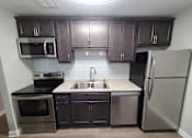Thumbnail 23 of 48 - backsplash and stainless steel appliances