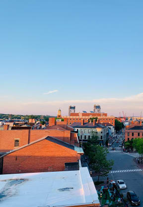 an aerial view of a church steeple in a city