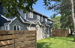 a house with a wooden fence