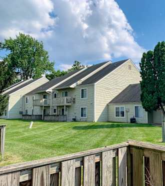 a white house with a driveway and a garage door