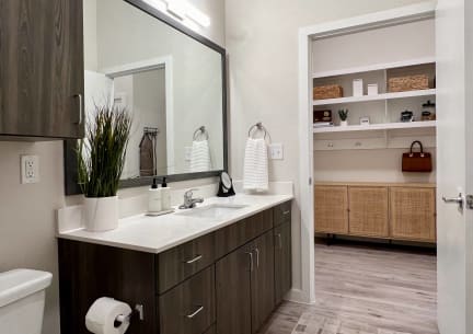 Spacious Bathroom with White Quartz Counters and Framed Mirror in Austin, Texas