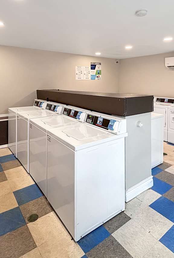 A laundry room with a washer and dryer.