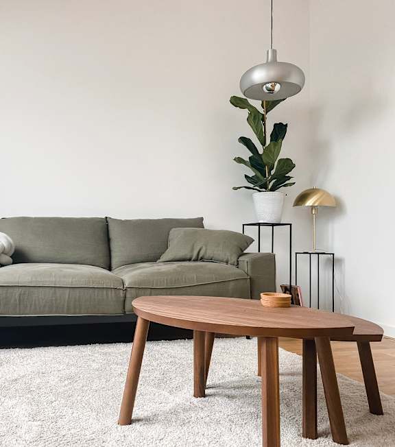 a desk with a chair and a lamp in a room