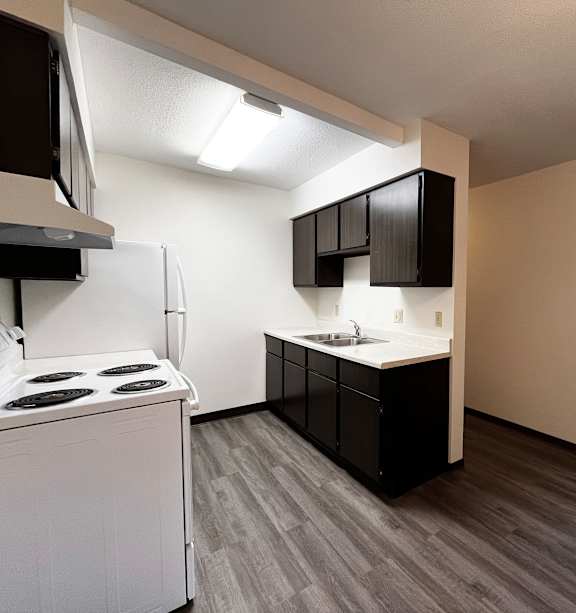 a bedroom with a bed and a ceiling fan
