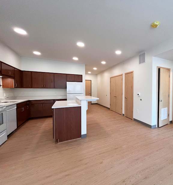 a bedroom with a bed and a ceiling fan