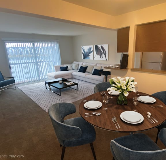 Living Room & Dining Area at Southport Apartments in Belleville, MI 48111