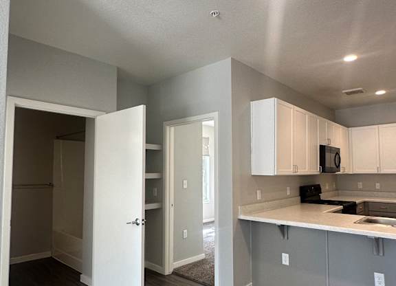 A modern kitchen with a sink and a counter.
