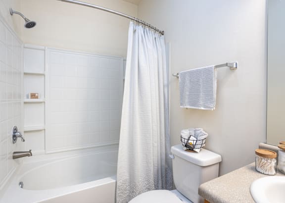 a bathroom with a toilet sink and bathtub