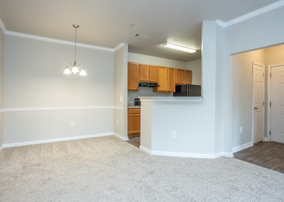a living room filled with furniture and a ceiling fan