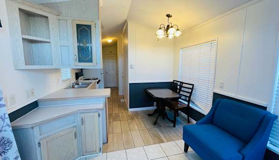 Two female roommates hanging out on couch at Salinas Sunset Apartments, Salinas, CA, 93907