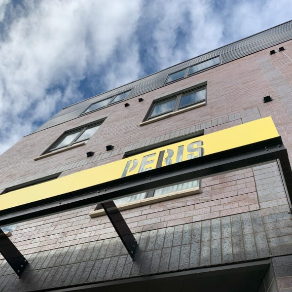 the facade of a building with a sign on it