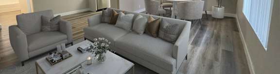 a living room with couches and a coffee table