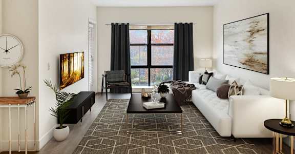 Living room with white couch and brown rug at FREMONT MEWS, Sacramento, California