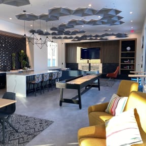 a room with a ping pong table and a bar