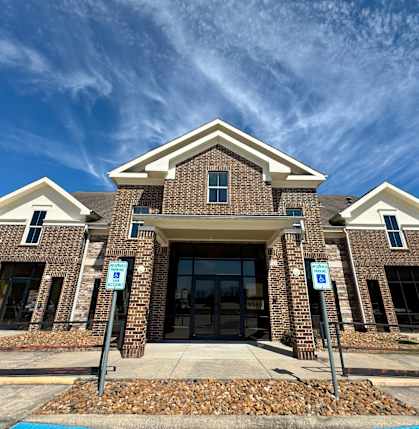 A building with a brick facade and a large entrance.