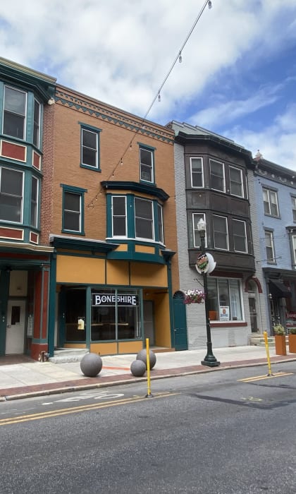 a row of buildings on a city street