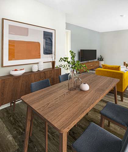 a living room and dining room with a wooden table at The Junction, Memphis, TN