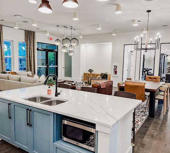 a kitchen with a large island and a living room with a dining room at Hamilton Reserve, Greensboro, NC