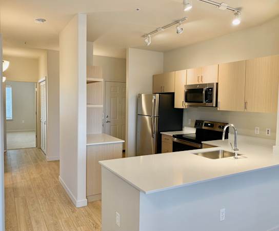Kitchen with stainless steel appliances at Wilsonville Summit Apartments, Wilsonville , Oregon