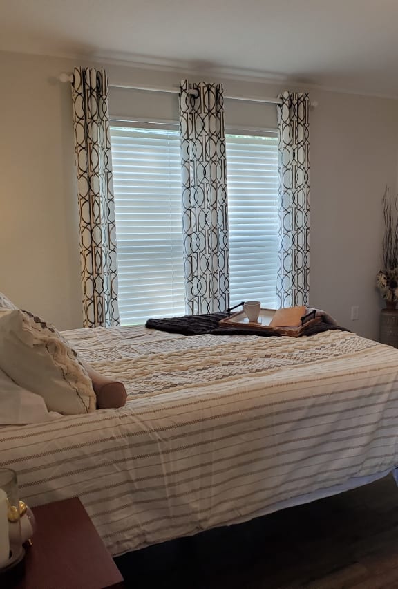 a bedroom with a bed in a room at West Winds in Cheyenne, WY