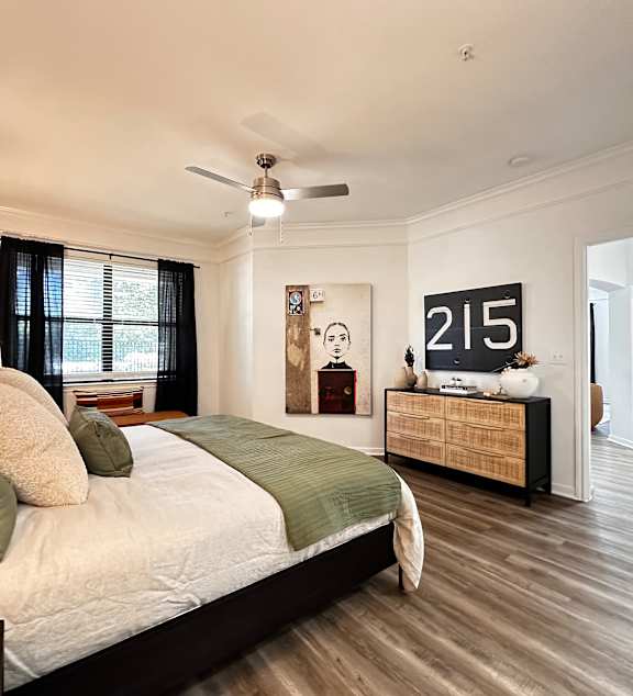 a bedroom with a large bed and a window at Grand Villas Apartments, Katy