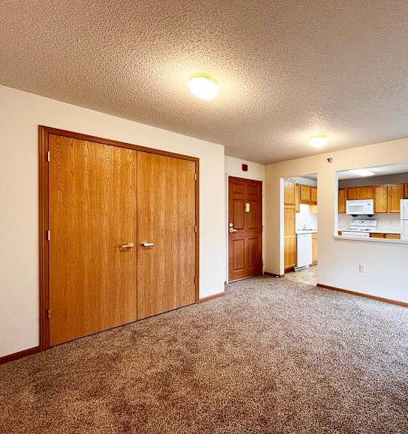 a bedroom with a bed and a ceiling fan