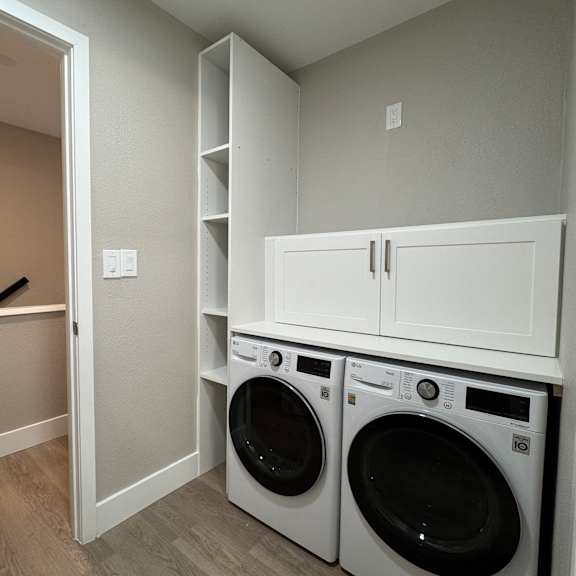 A laundry room with a washer and dryer.