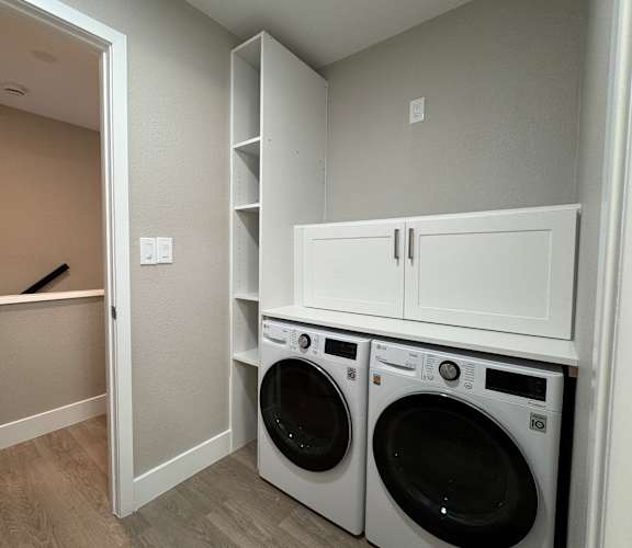 A laundry room with a washer and dryer.