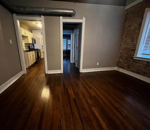Room with view into kitchen and bedroom