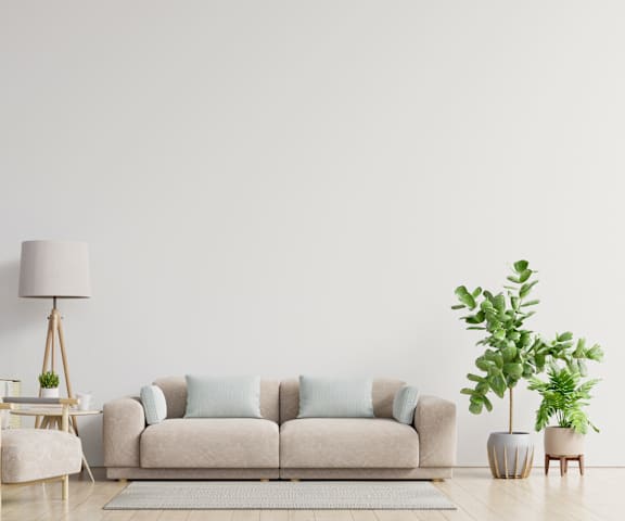 a couch in a living room with a white wall