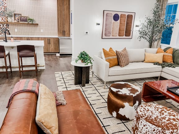 a living room with a couch and a table om with a couch and a table at Hamilton Reserve, Greensboro