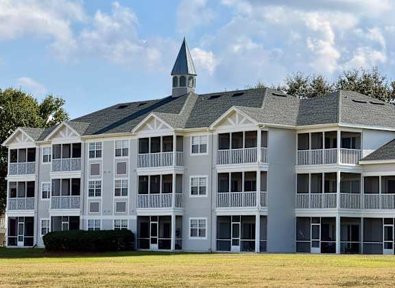 A large white building with a tower on top of it.