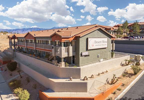 A building with a sign that says Desert Mesa.