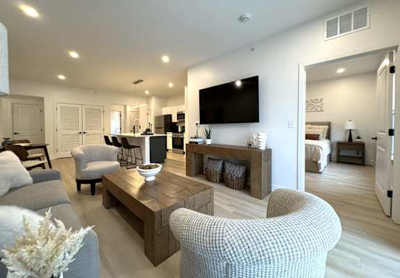 View of typical great room living area and entrance to primary bedroom