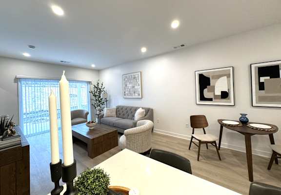 View of great room towards dining & living area and sliding glass doors to private patio