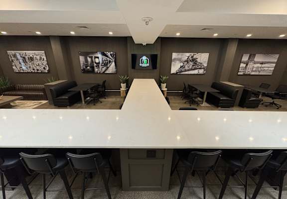 A conference room with a long table and chairs.