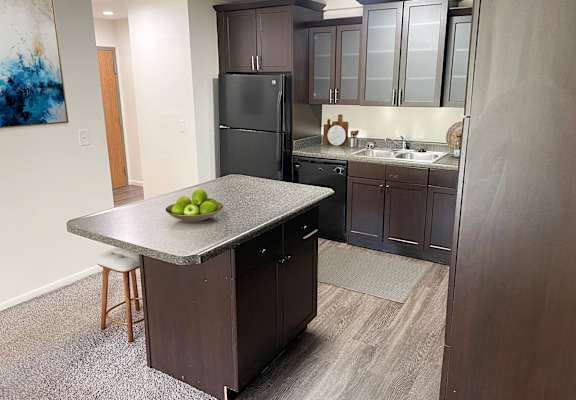 A spacious kitchen at apartments in East Lansing near Michigan State University | Americana Apartments in East Lansing, Michigan