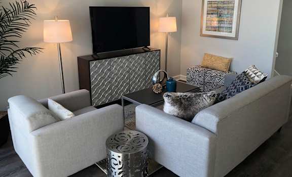a living room with a couch and a tv