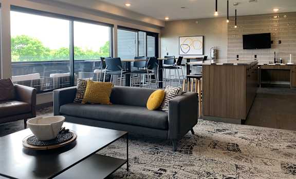 The sky lounge with couches, tables, seating, and access to sky deck