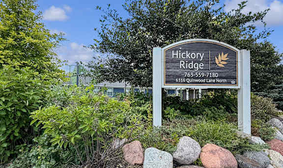 A sign for Hickory Ridge with a phone number and address.
