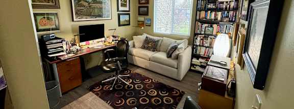 Bedroom office with a couch and a desk at Briarlane Apartments in Grand Rapids