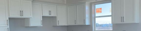 A view of a staircase leading to a bedroom with a window.
