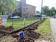 A construction site with a sign that says "Emergency Authorized Vehicles Only".
