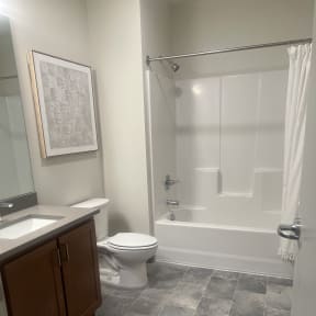 a small bathroom with a toilet and a bath tub
