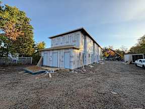 A house under construction with the name "Tyvek" written on the side.