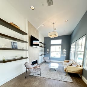 a large open living room with a staircase and a modern design at The Bryant Apartments at Yorba Linda, California